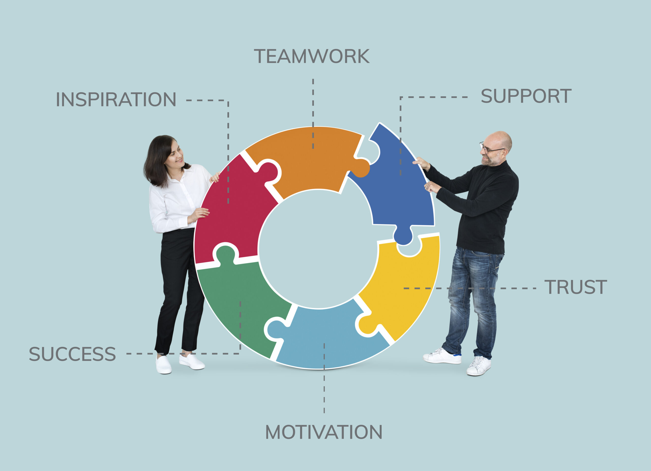 Business partners connecting jigsaw puzzle pieces Business partners connecting jigsaw puzzle pieces